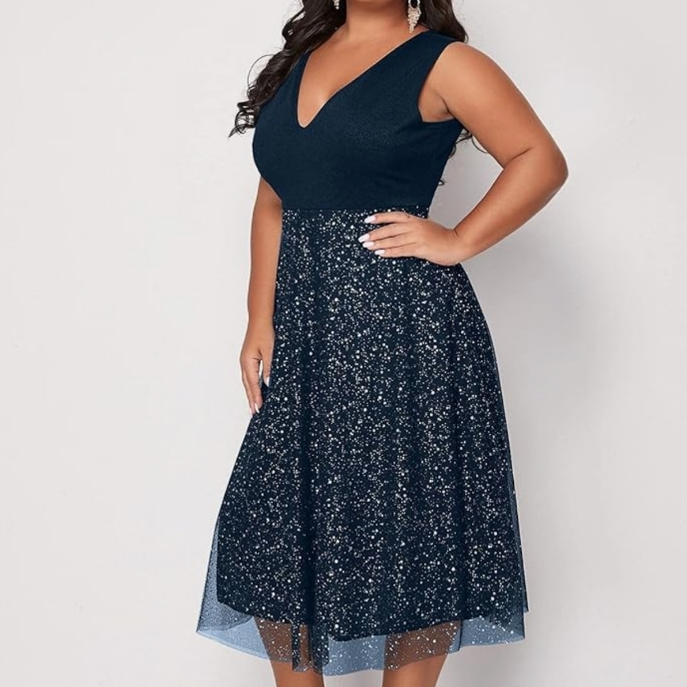 Navy blue sleeveless plus size cocktail dress with silver polkadot